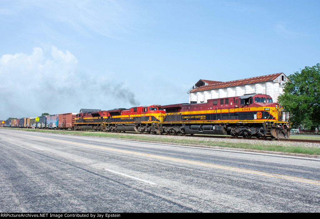 KCSM 4549 accelerates south through the small town of Louise 